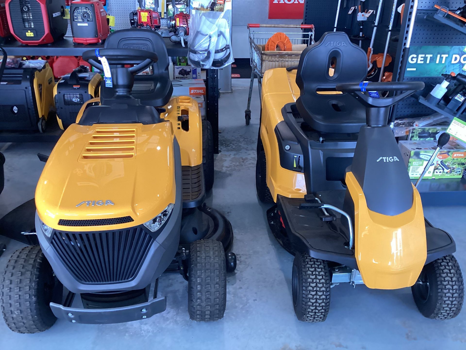 Green Ride-On Lawn Mower in Operation — Lawn Mowers In Bowen QLD