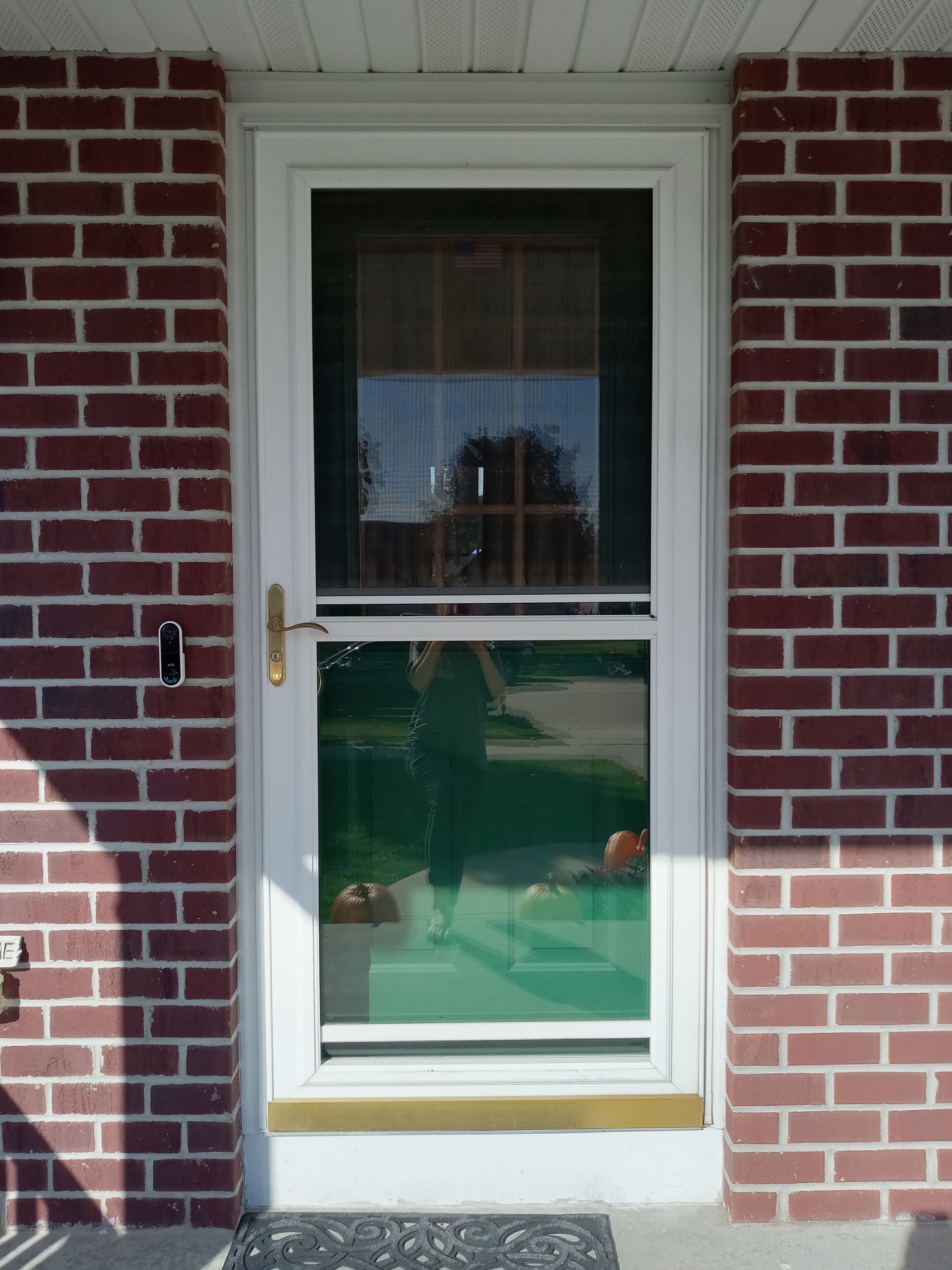 A red brick building with a white door