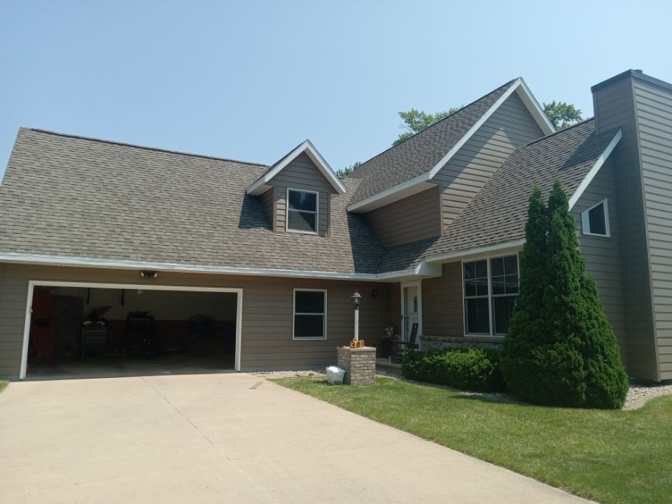 A large house with a garage and a driveway
