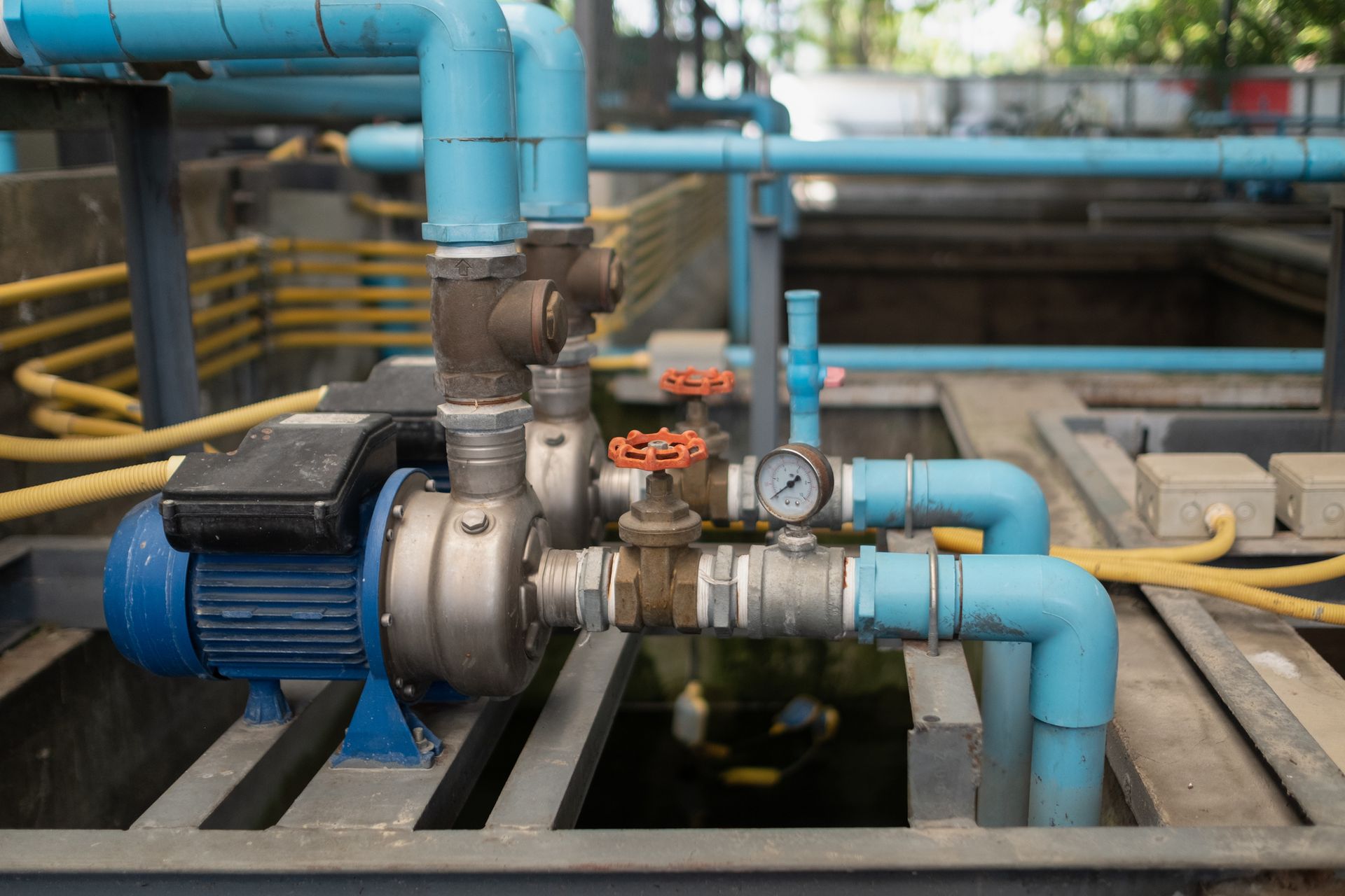 The water pump is located on the sewage well consisting of PVC pipe.