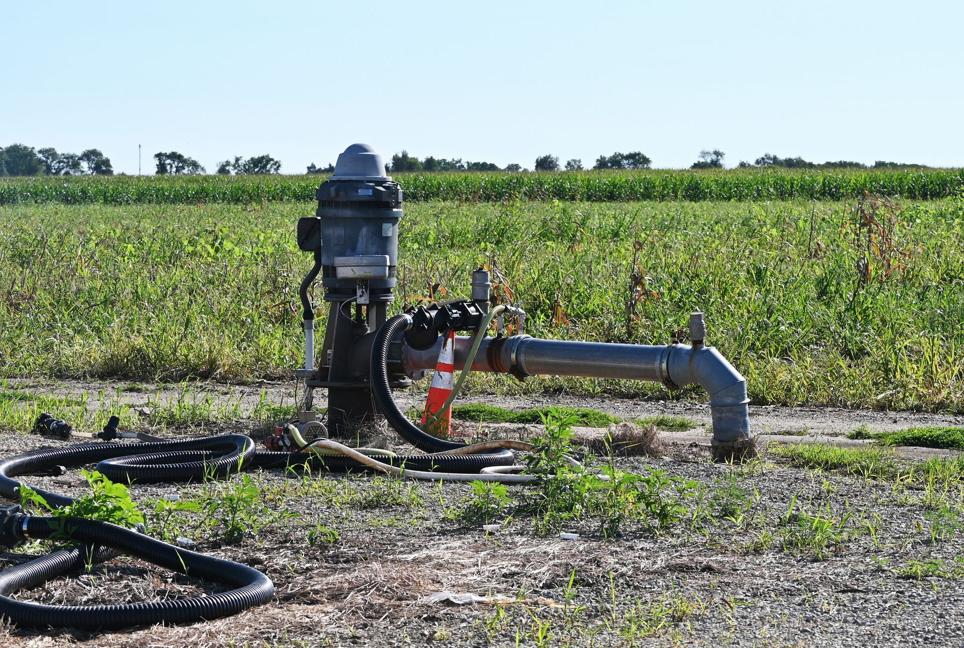 Irrigation well in the country by the cornfield.