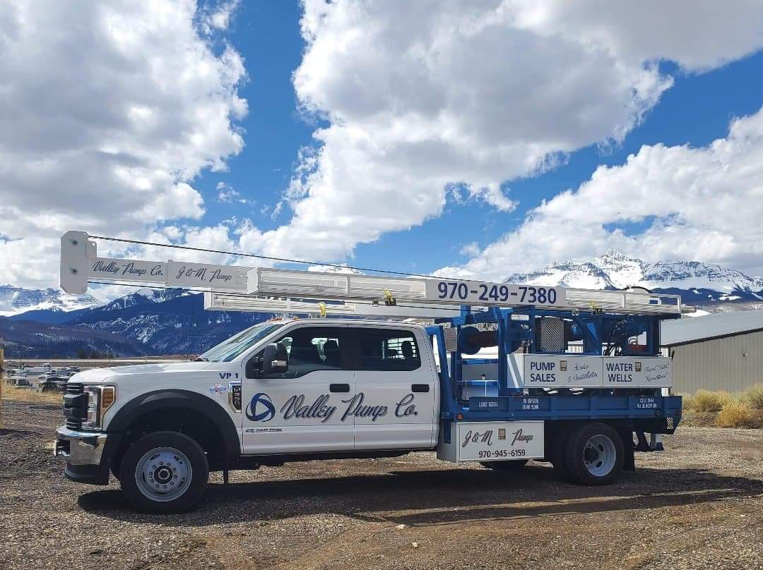White truck with a crane, 
