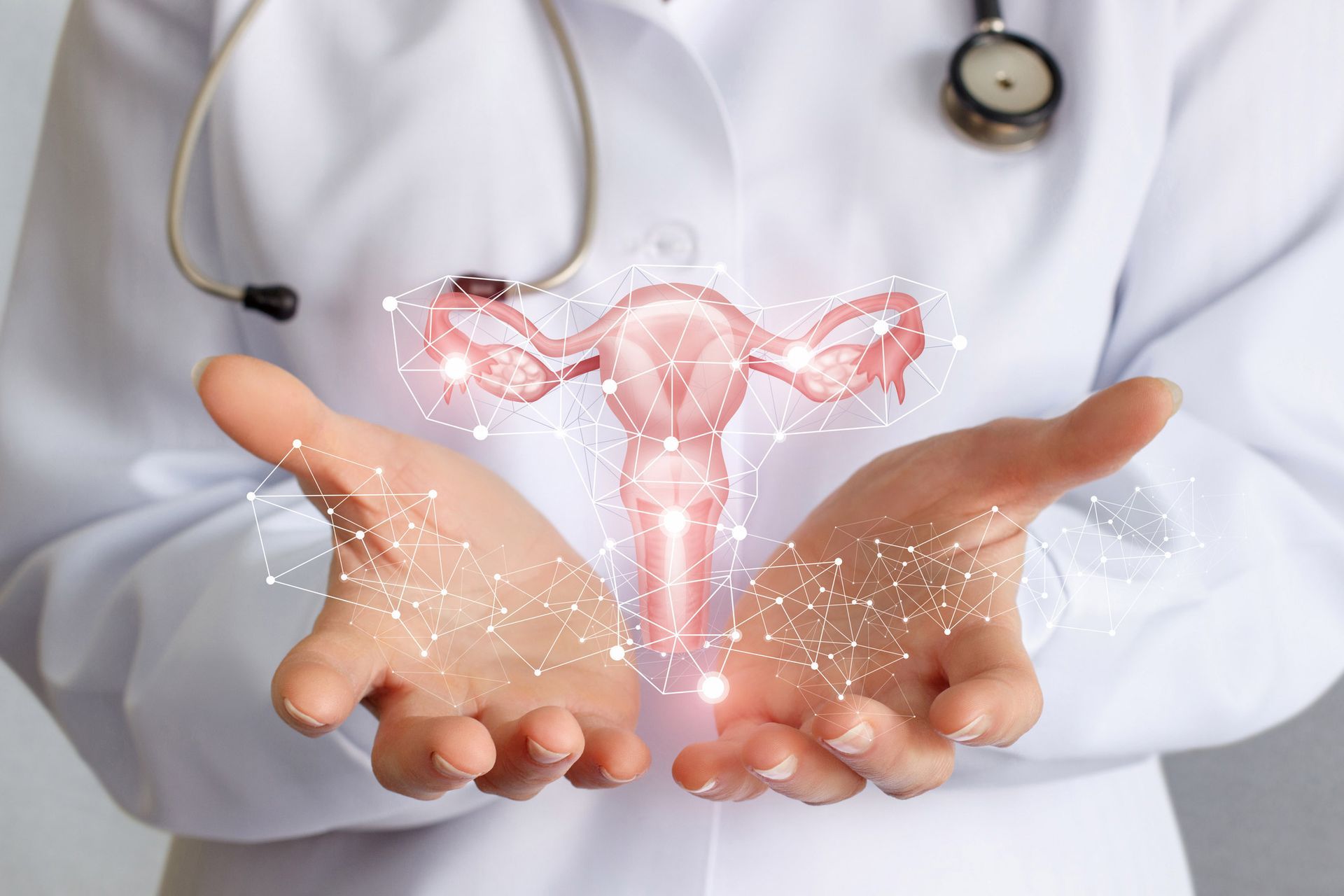 A medical professional presents a woman's reproductive system, promoting OB/GYN services in San Anto