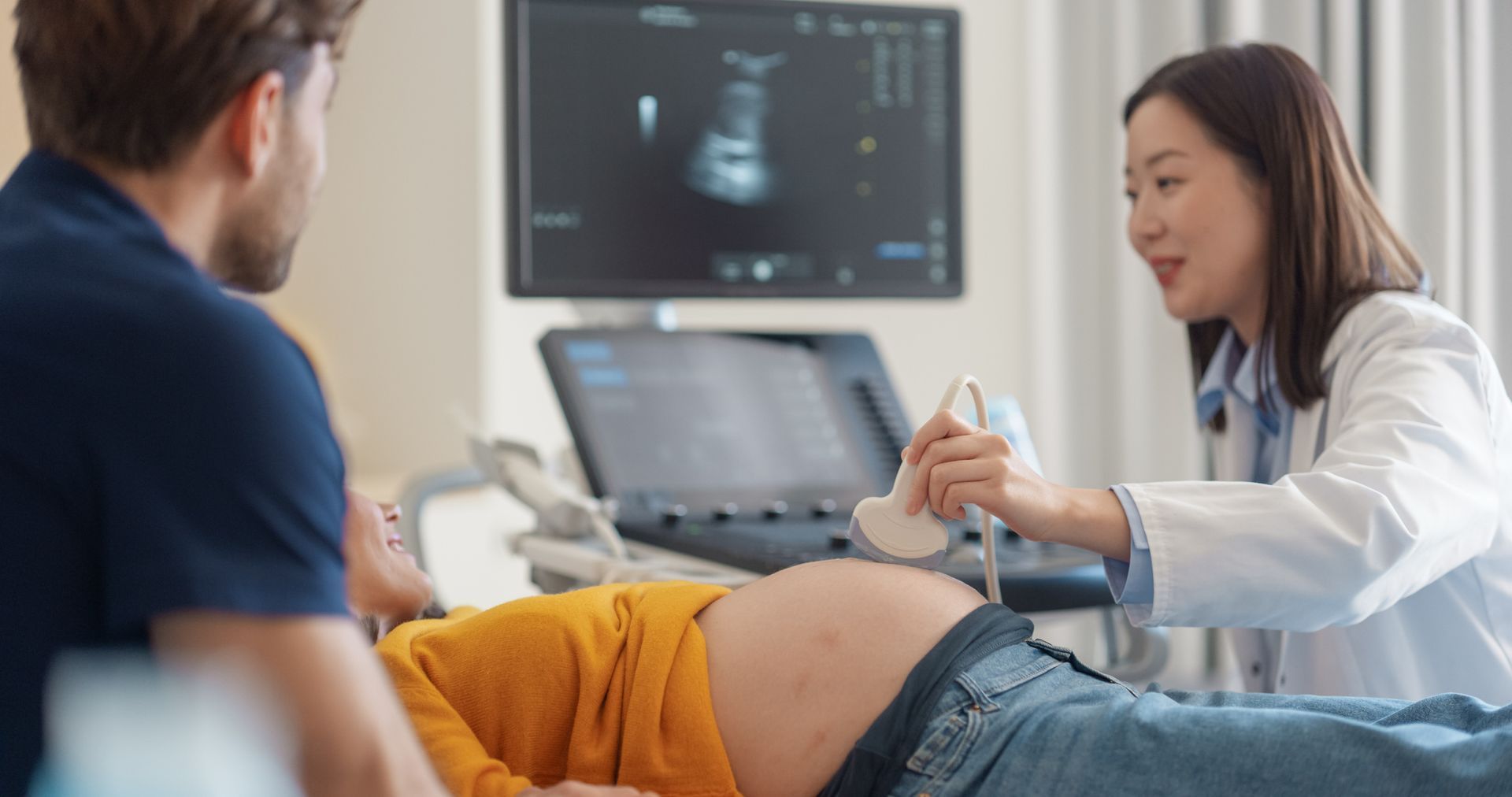 A woman is getting a prenatal ultrasound. A woman is getting a prenatal ultrasound.
