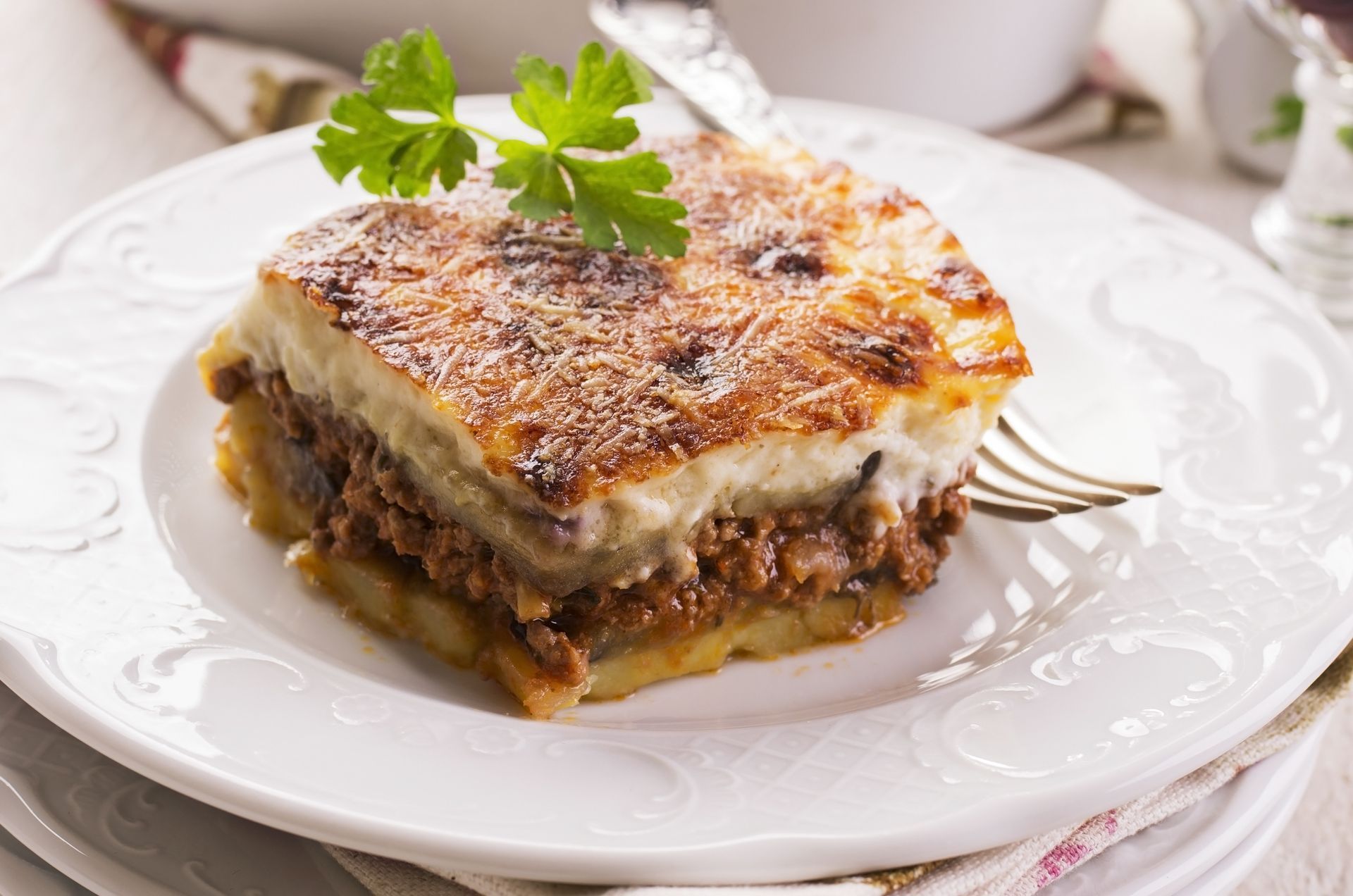 Mousaka on white plate.