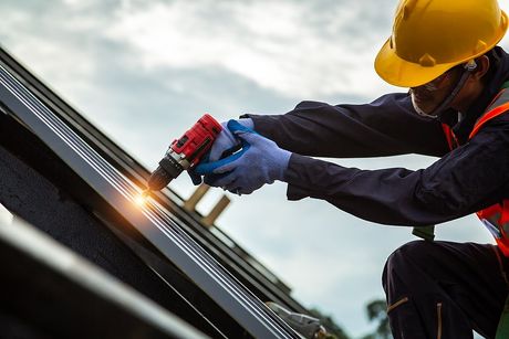 a roofer repairing roof
