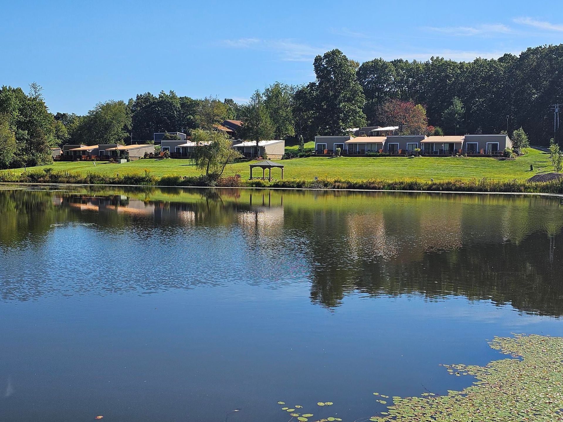 view of lake lenore and the the outside of the rooms at Lodge at Chalk Hill