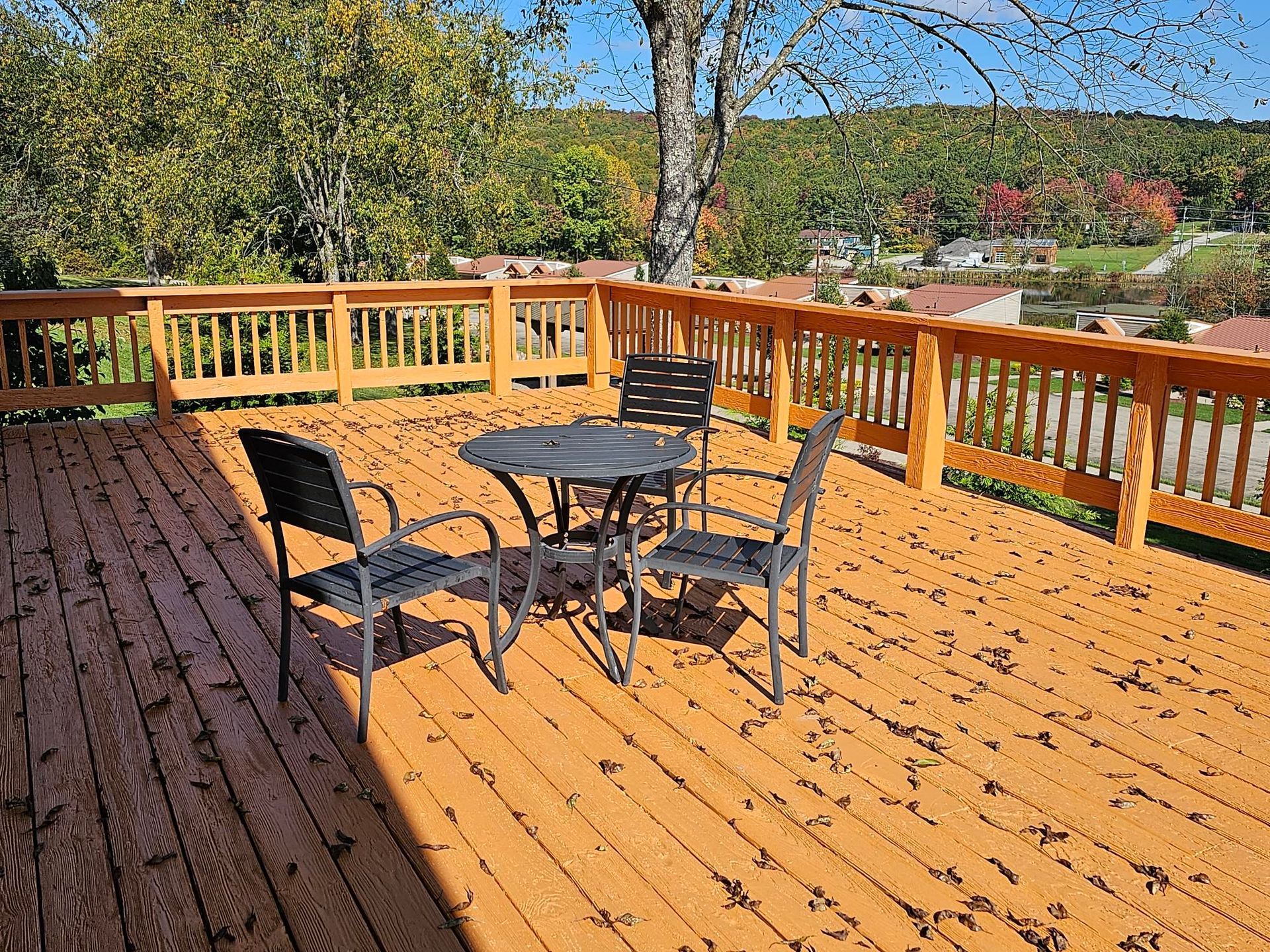 tables and chairs on the deck of the main lodge