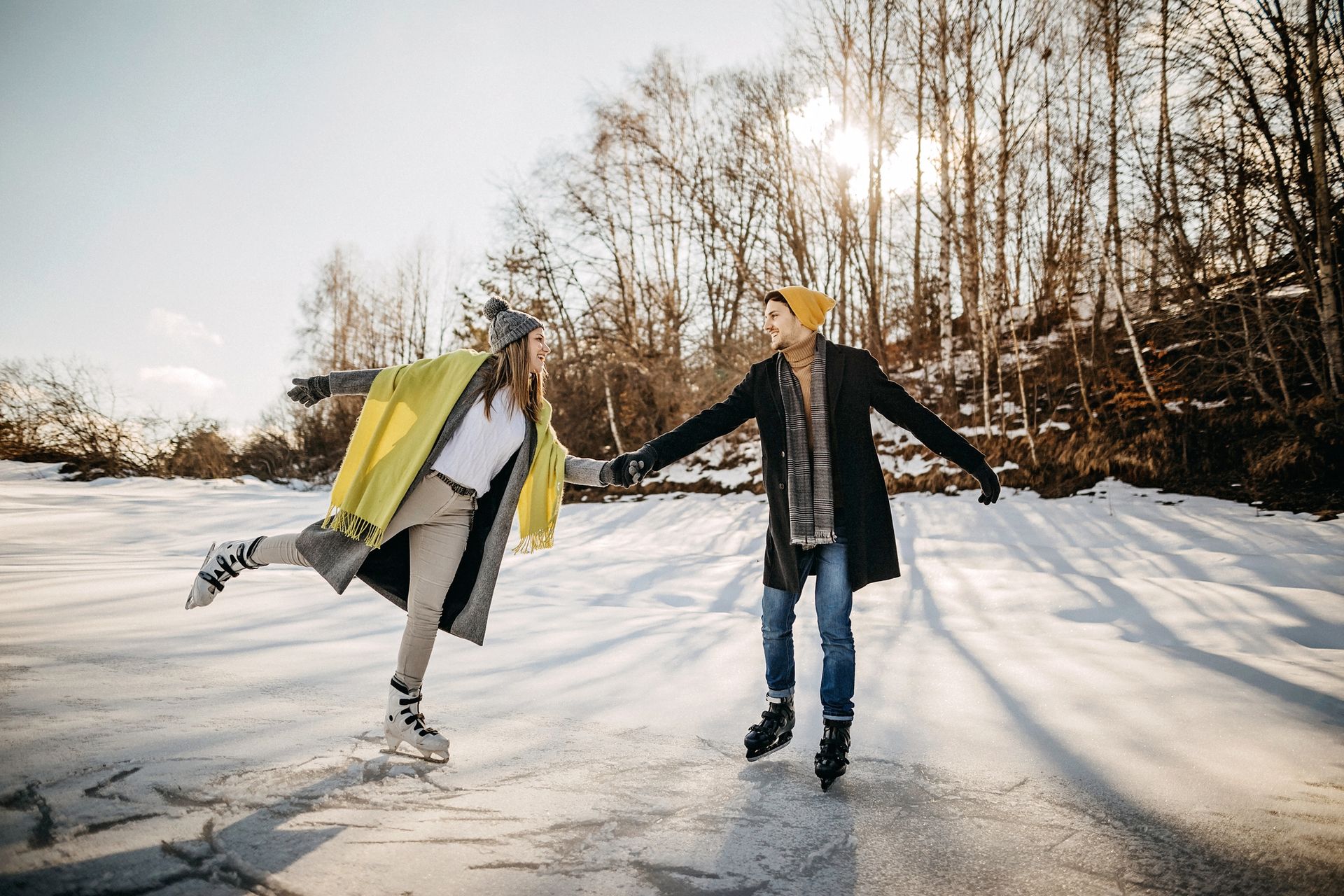 couple ice skating outdoors on a romantic getaway in southern PA