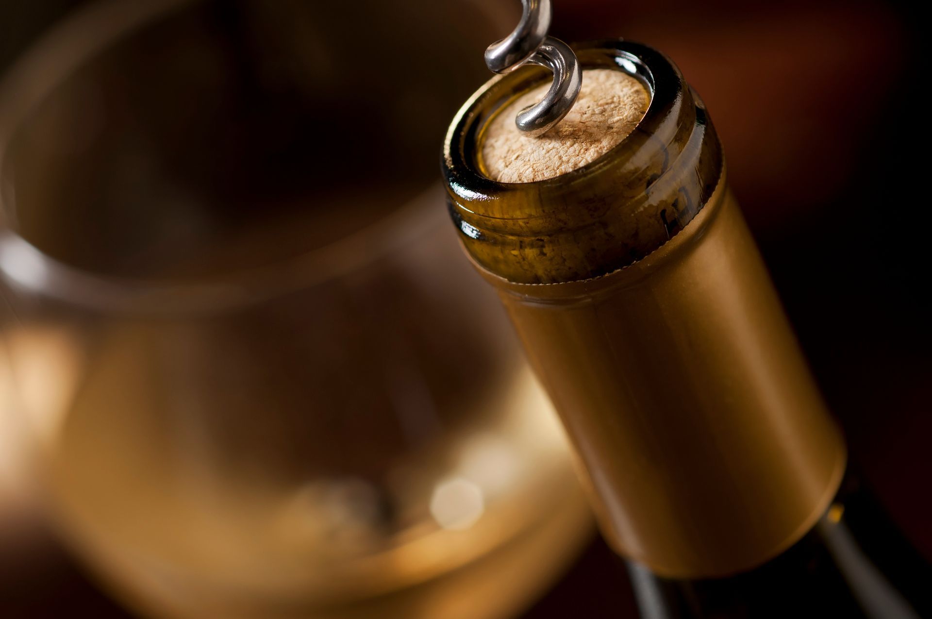 using a corkscrew to unopen a wine bottle