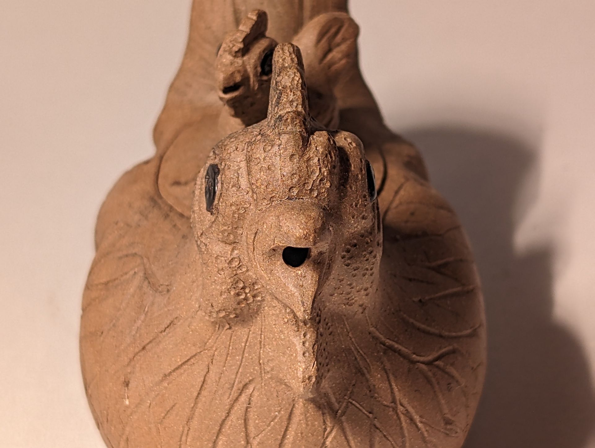 A close up of a chicken tea pot