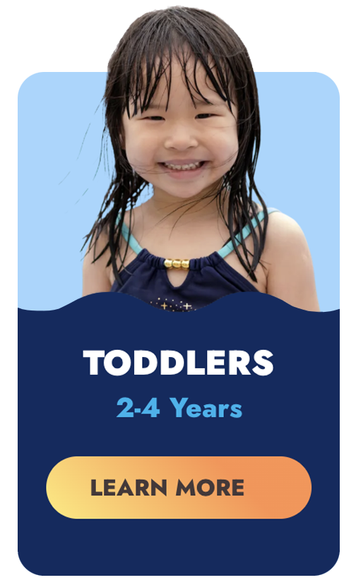 Young toddler with wet hair smiling;