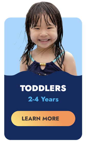 Young toddler with wet hair smiling;