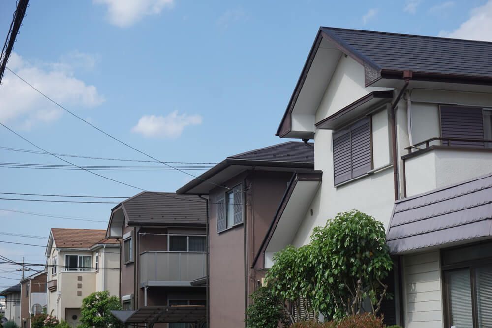 A Row of Houses with A Blue Sky in The Background — Marks Financial Group in  Toowoomba City, QLD