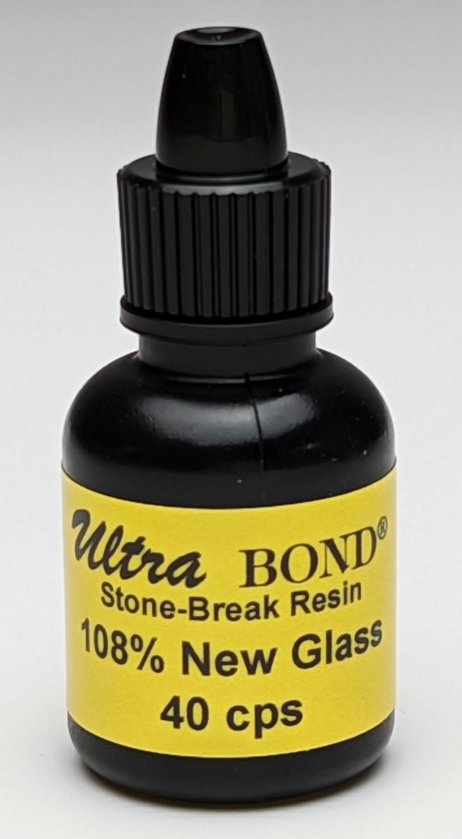 A small bottle of ultra bond stone-break resin