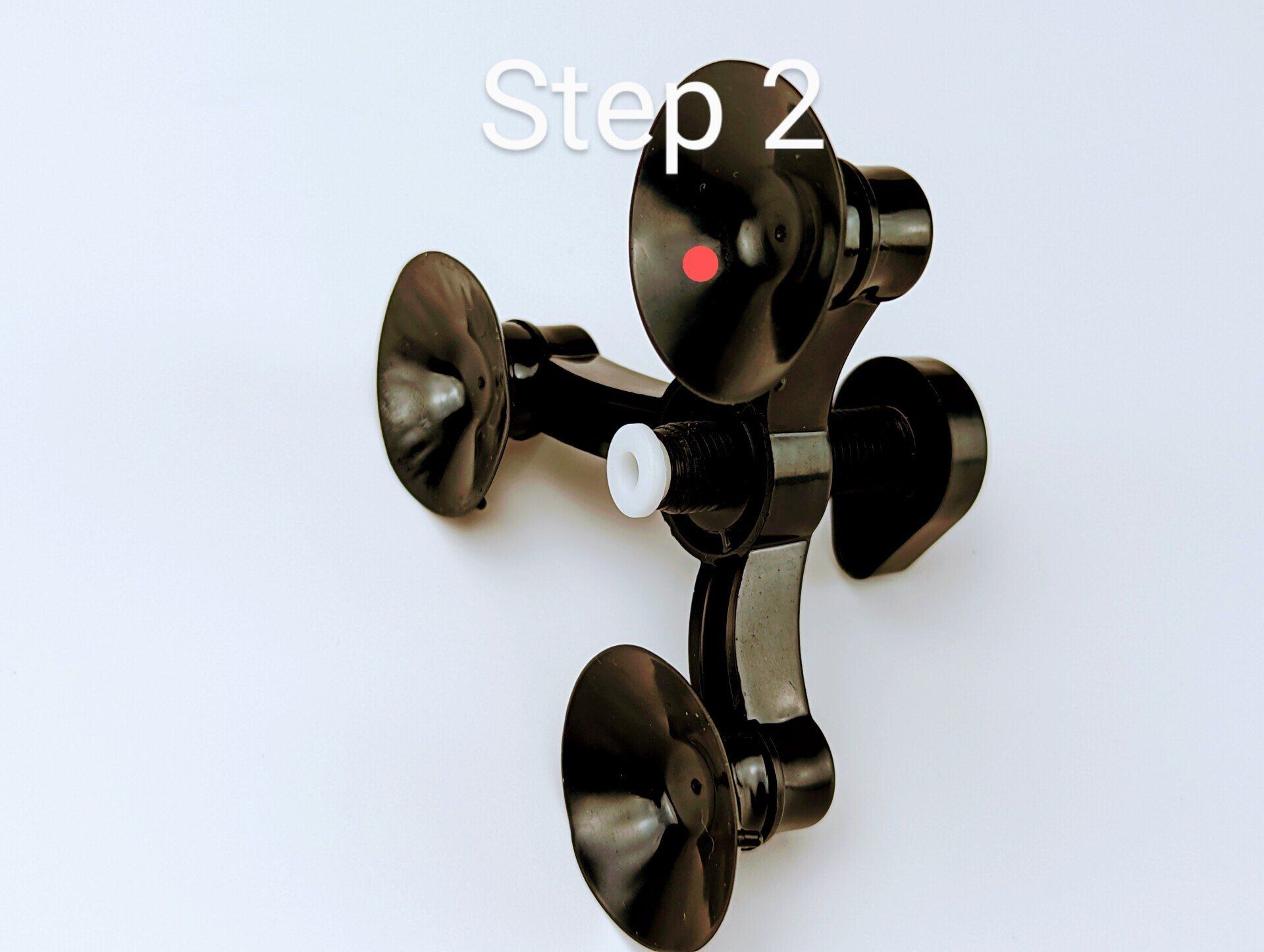 A picture of a black object with step 2 written above it