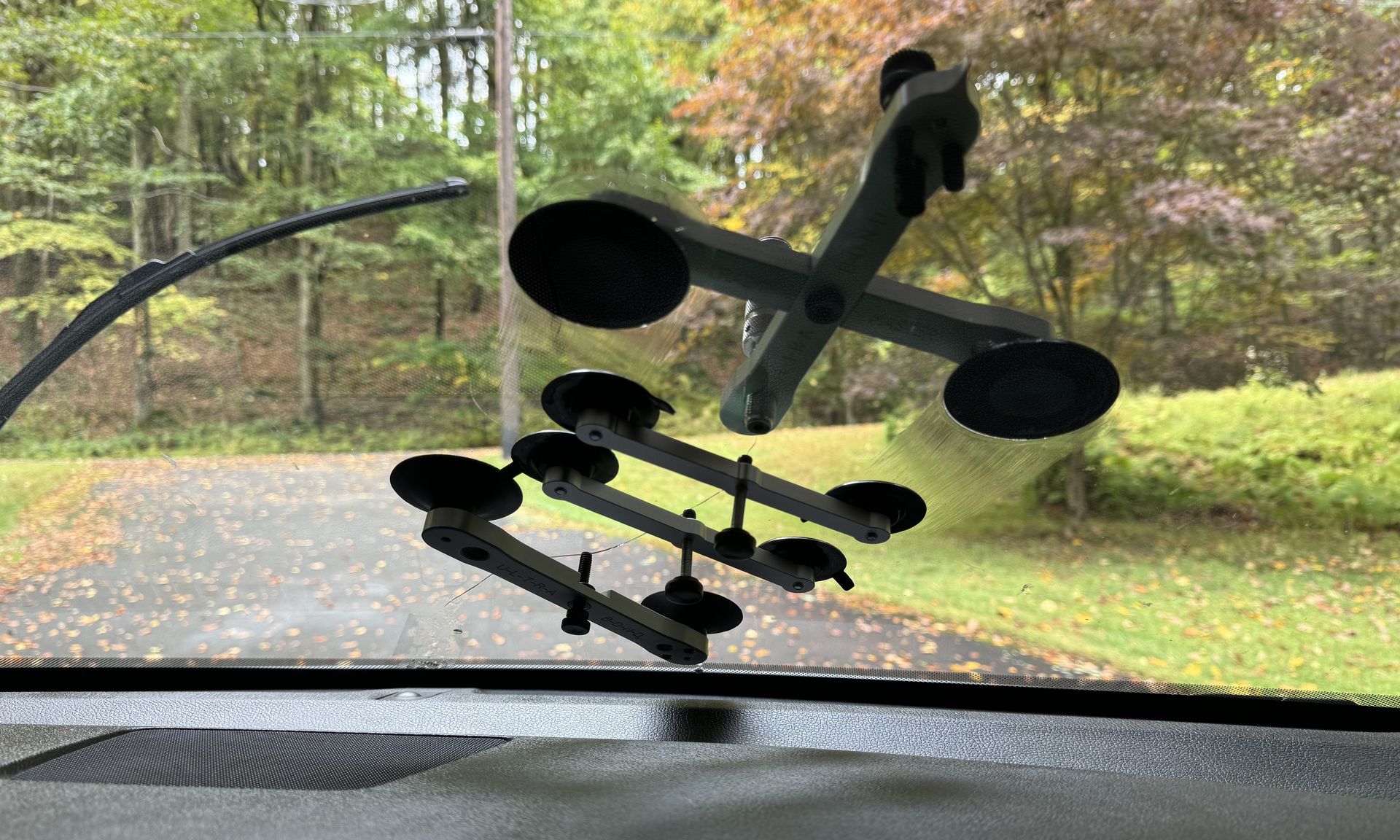 A close up of a repair of a windshield crack longer than six inches.