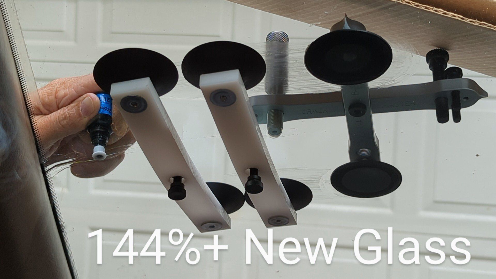 A person is holding a blue tube with a needle sticking out of it.