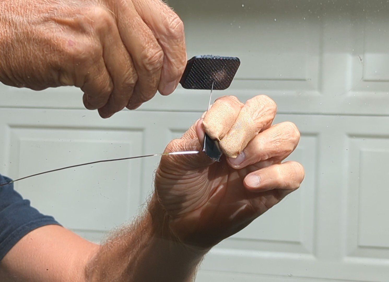 Tapping a bullseye at the drilled hole