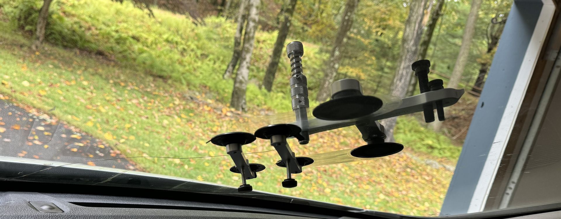 Ultra Bond long crack repair tools tools and resins  in progess on a long windshield crack repair 