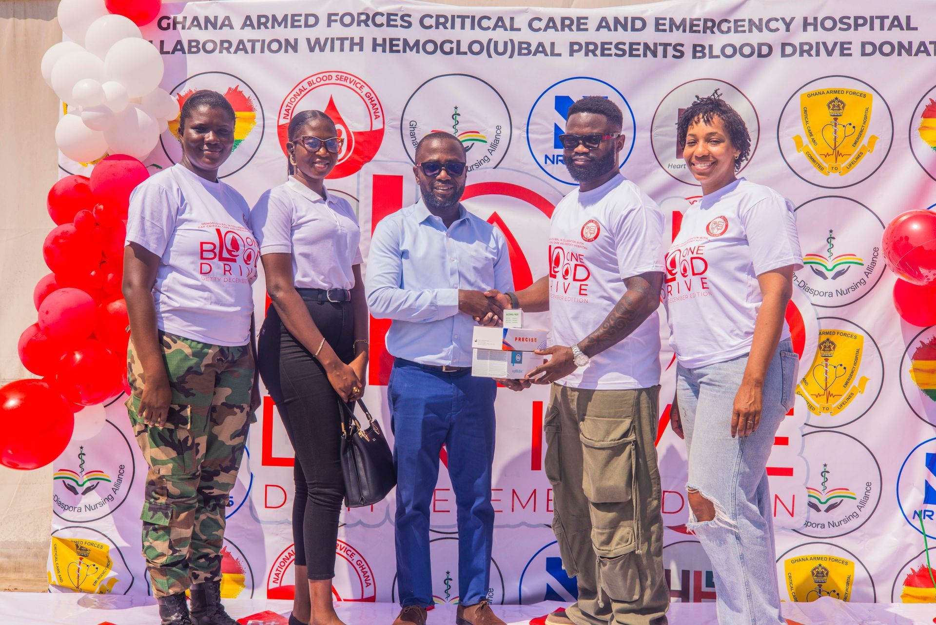 NR Meds team presenting medical supplies and resources during the One Blood Ghana donation event.