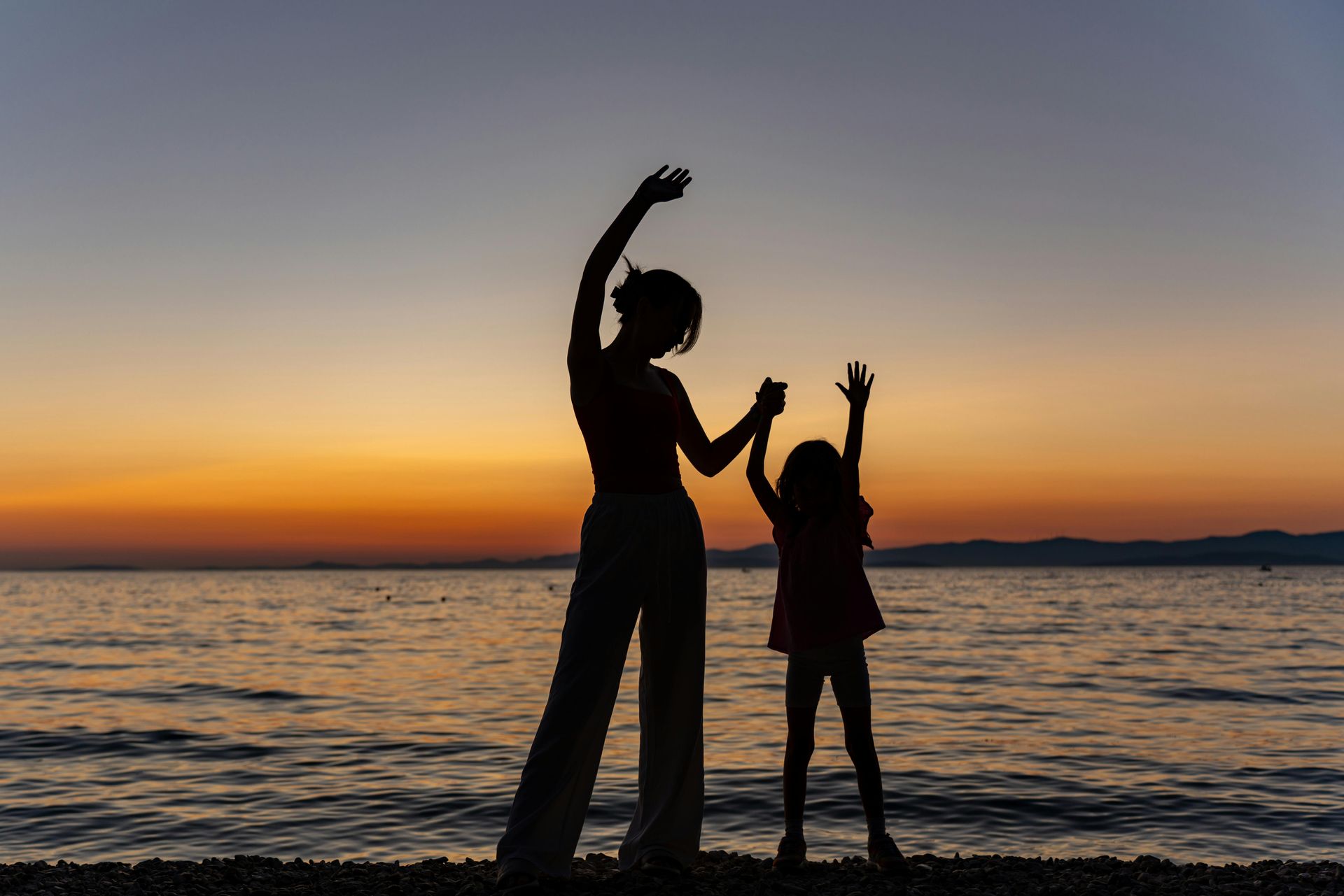 A mother and daughter by the sea