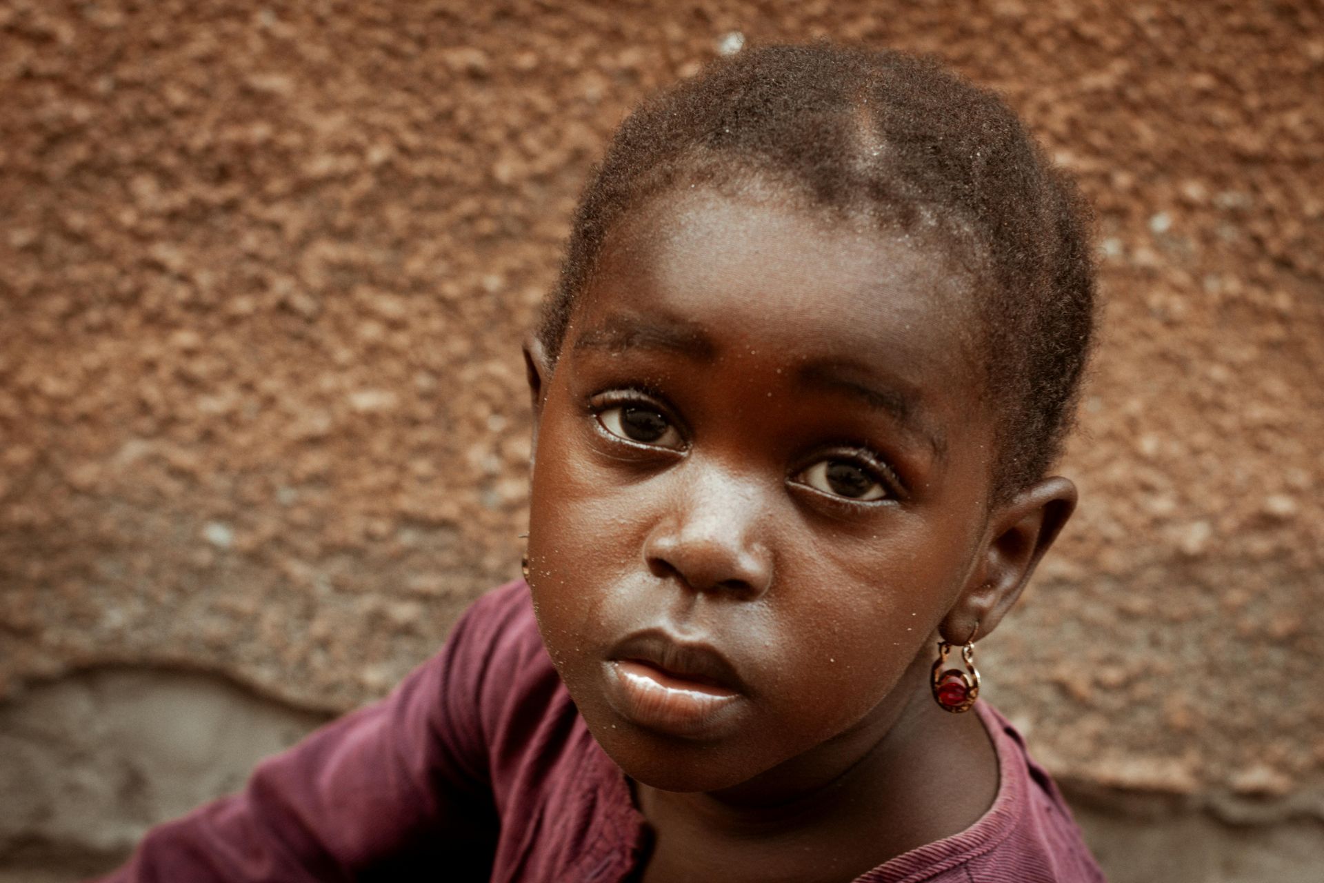 a girl child with a worried face