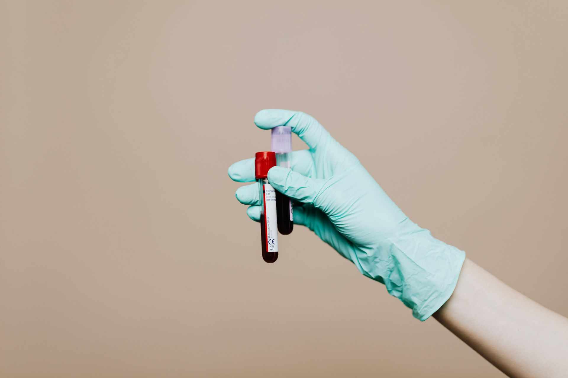 Hand holding Blood donated in a tube