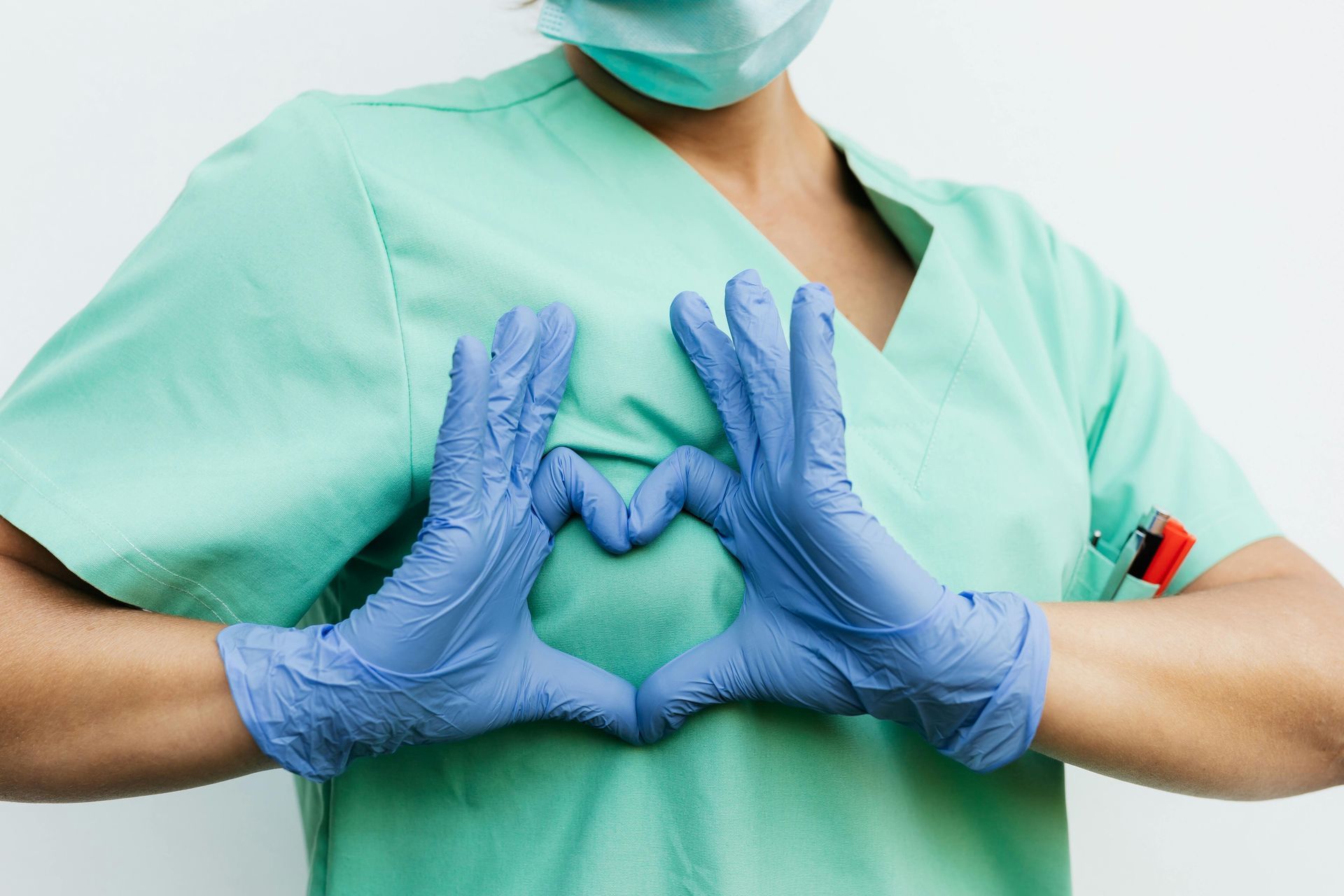 Medical personnel showing sign of love