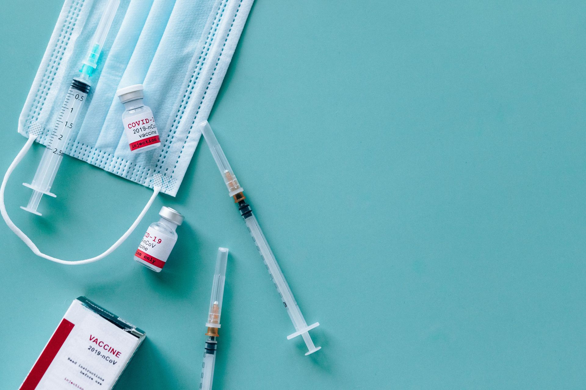 Medicines, face mask and syringes