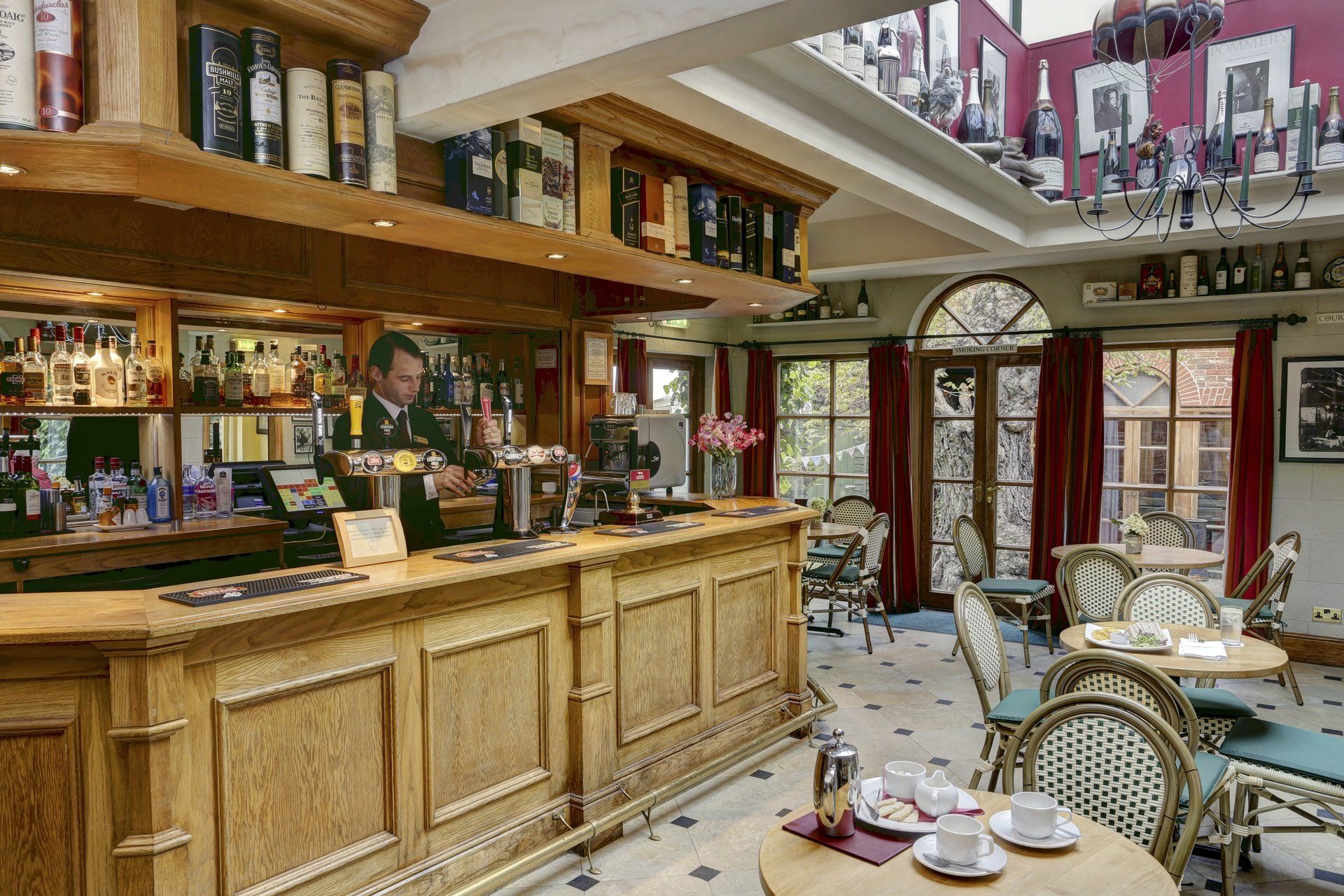 A restaurant with a bar and tables and chairs