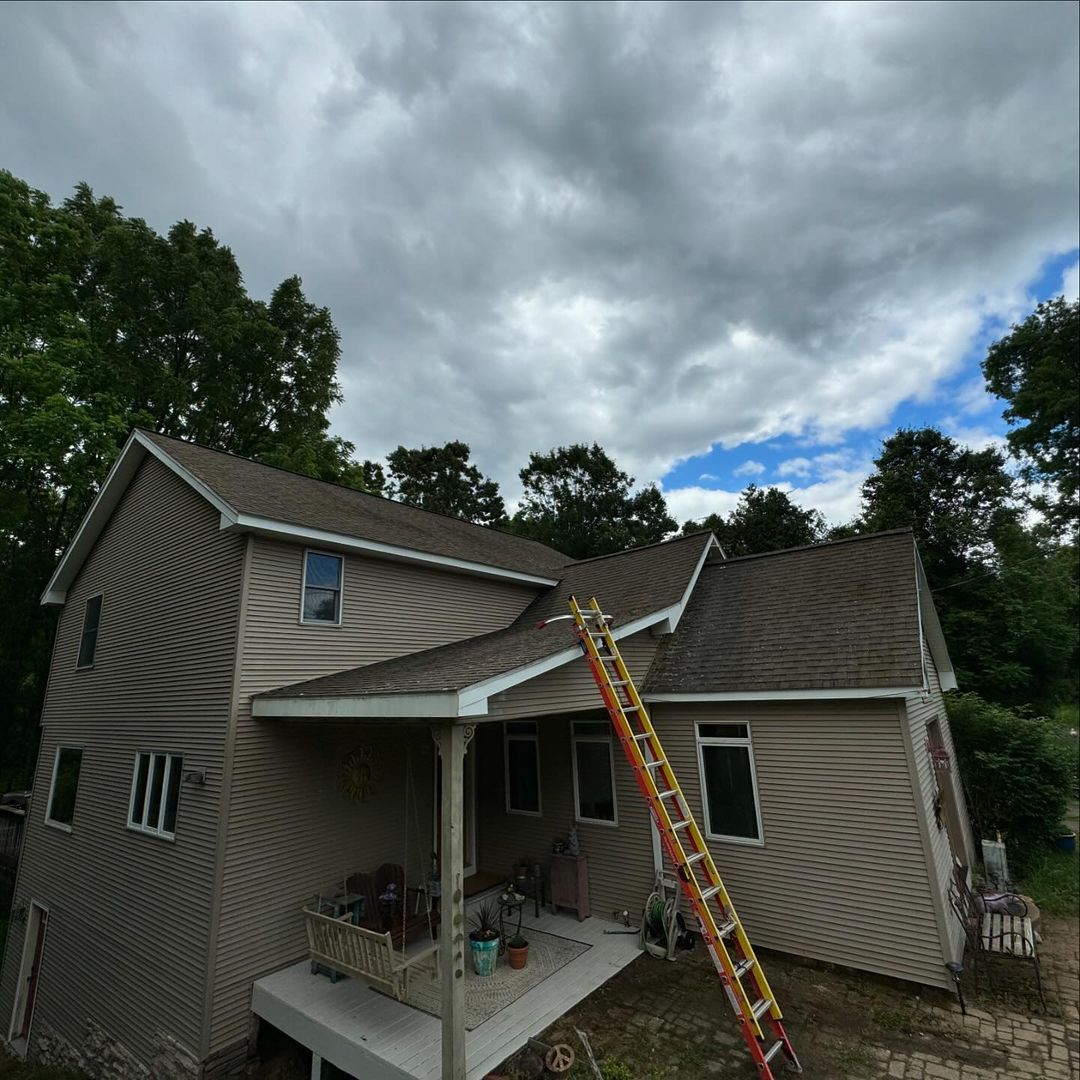 A house with a ladder on the side of it