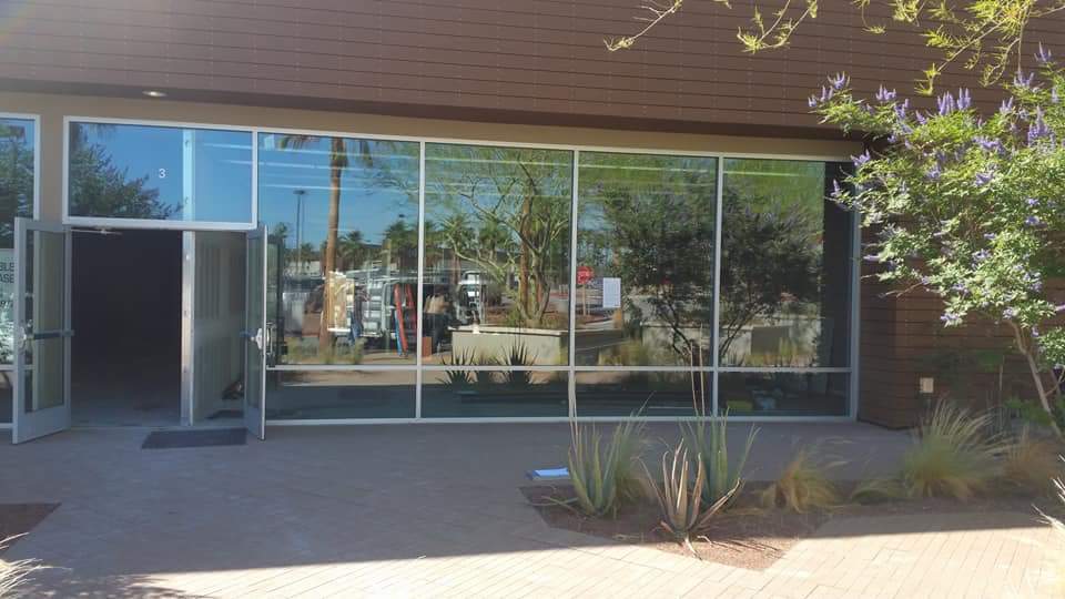 A large building with a lot of windows and a door.