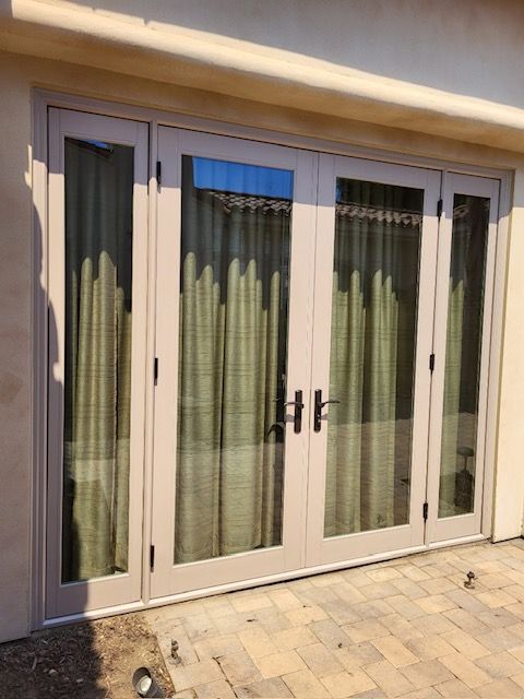 A door with a lot of windows and curtains on it