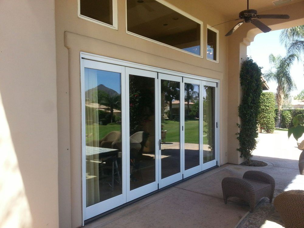 A house with a lot of windows and a ceiling fan