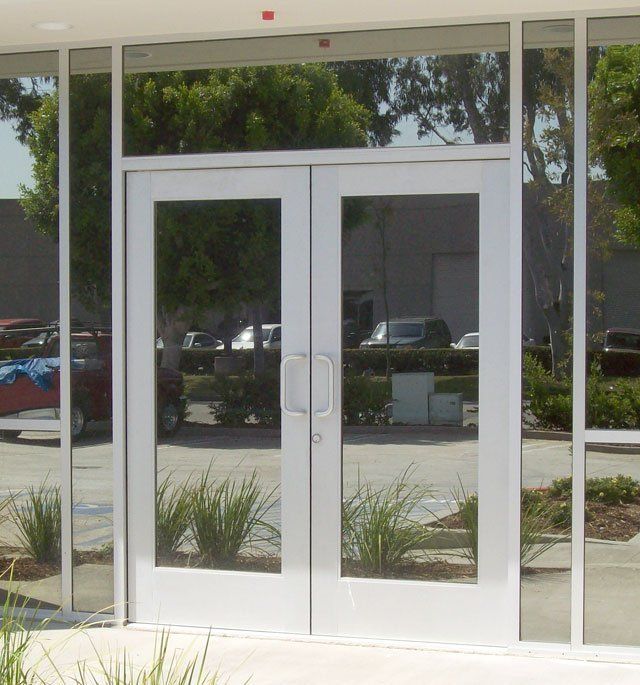 A white door with a lot of glass on it