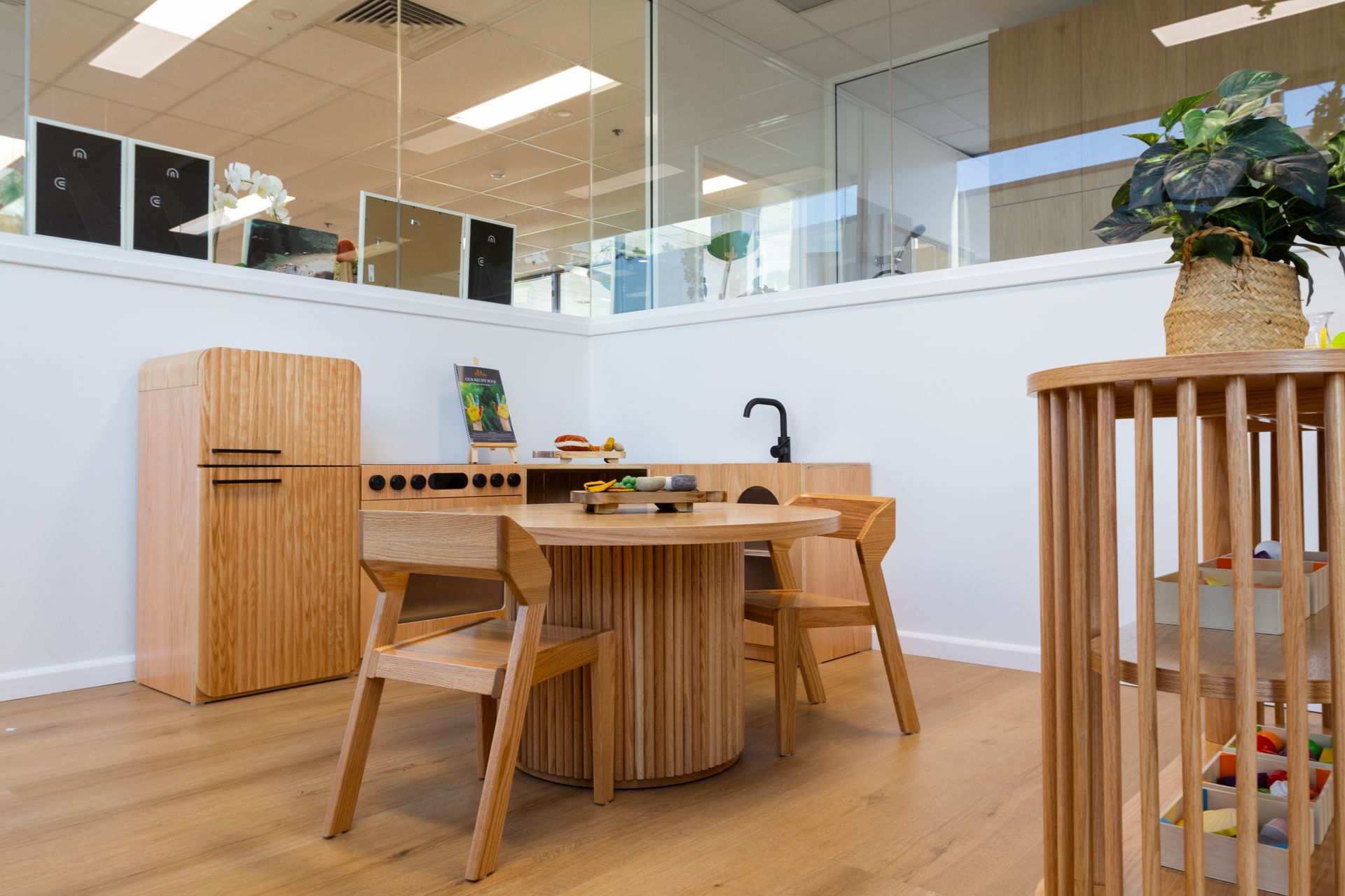 There is a table and chairs in the room.