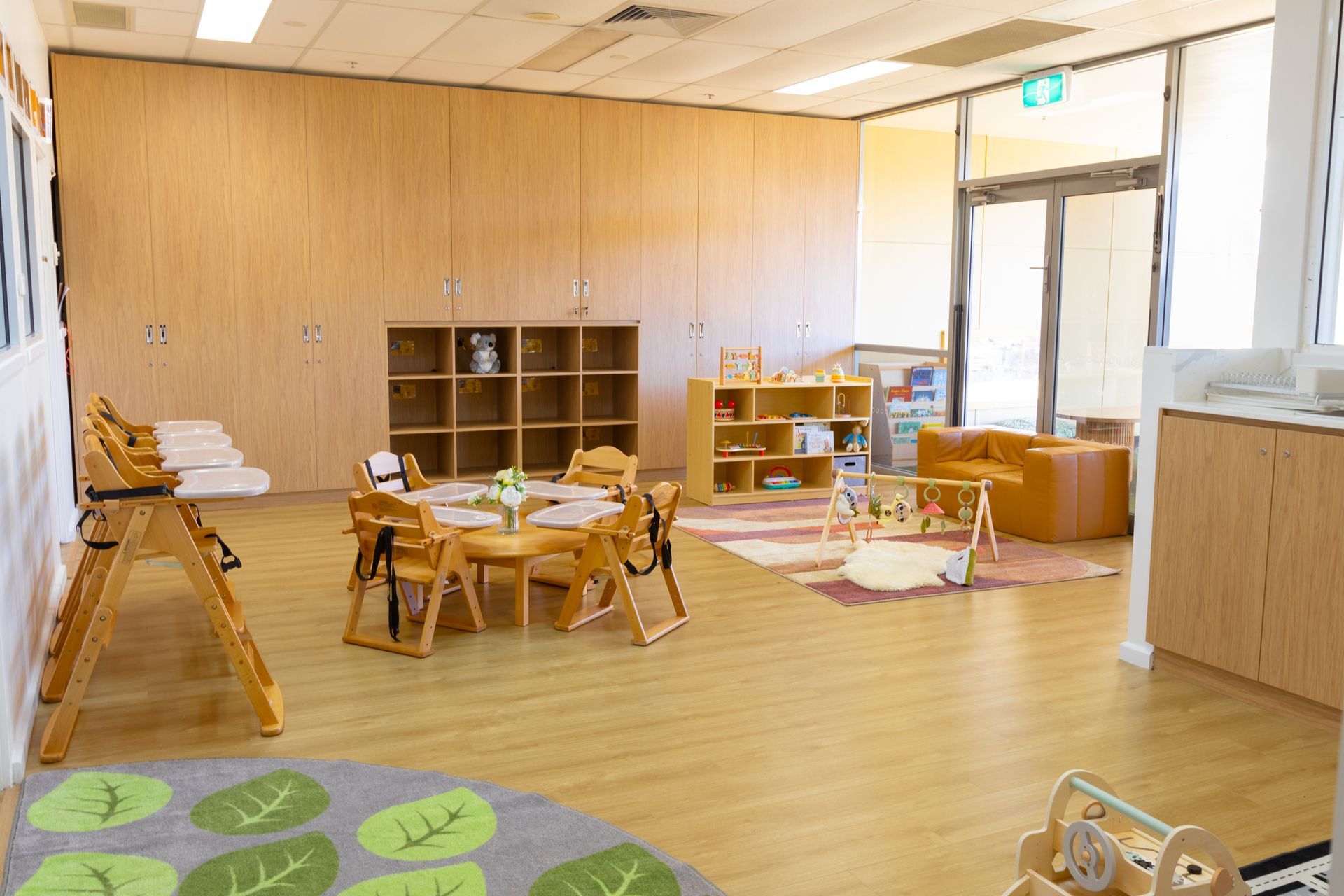 A large room with a table and chairs in it.