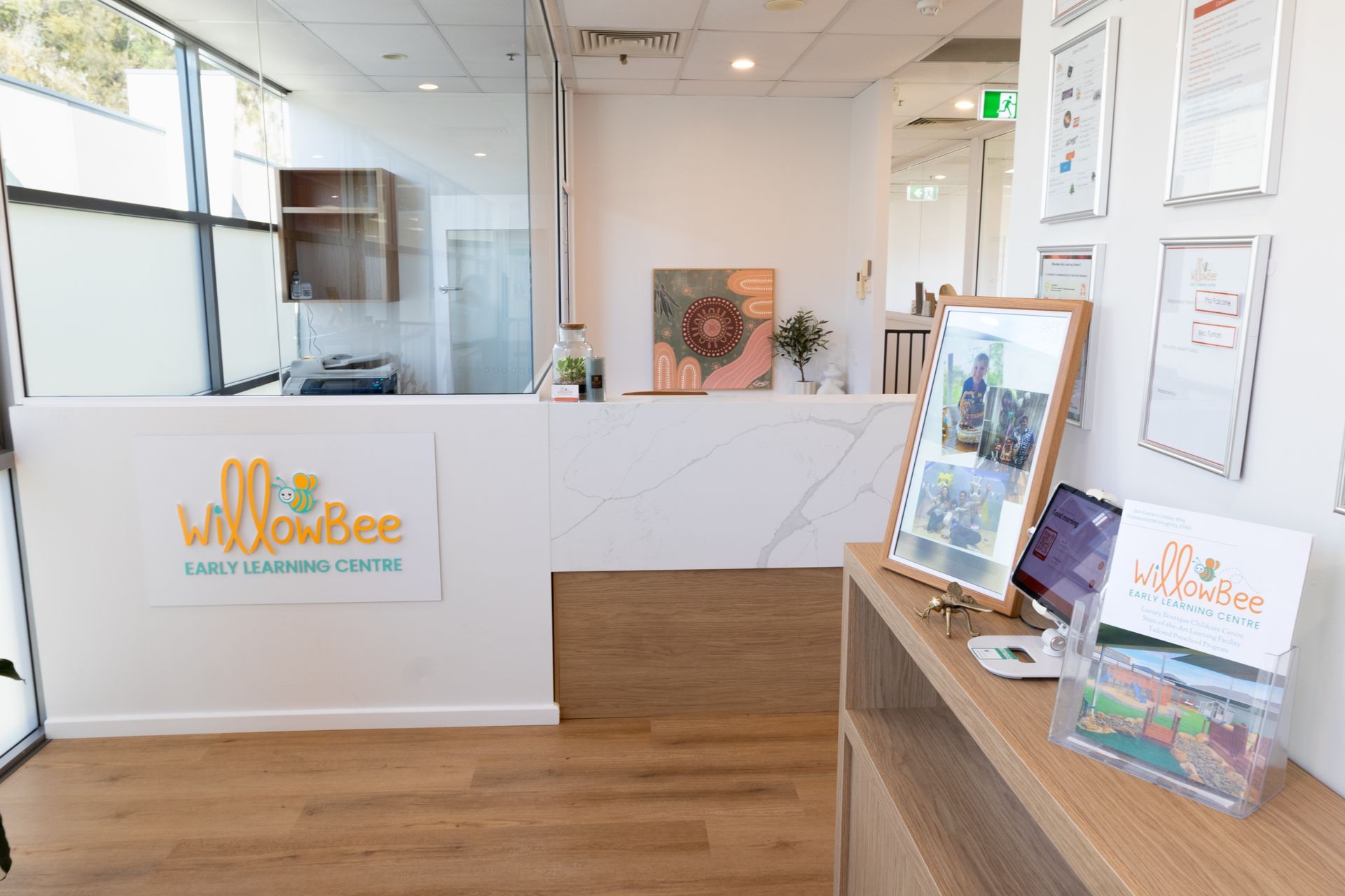 A reception desk in a hospital with a picture on it.