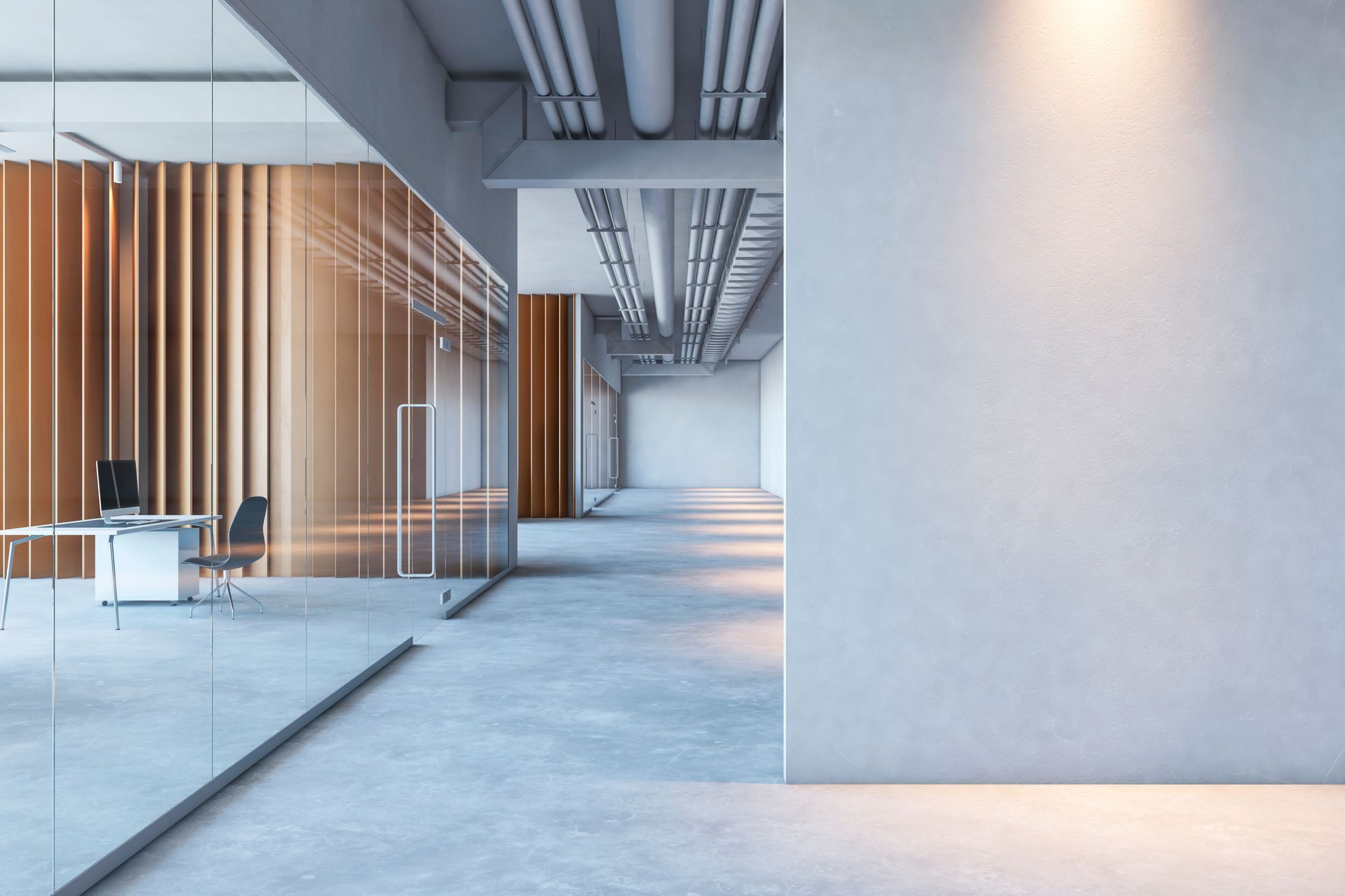Modern office hallway with glass walls, concrete floors, and a bright white accent wall.