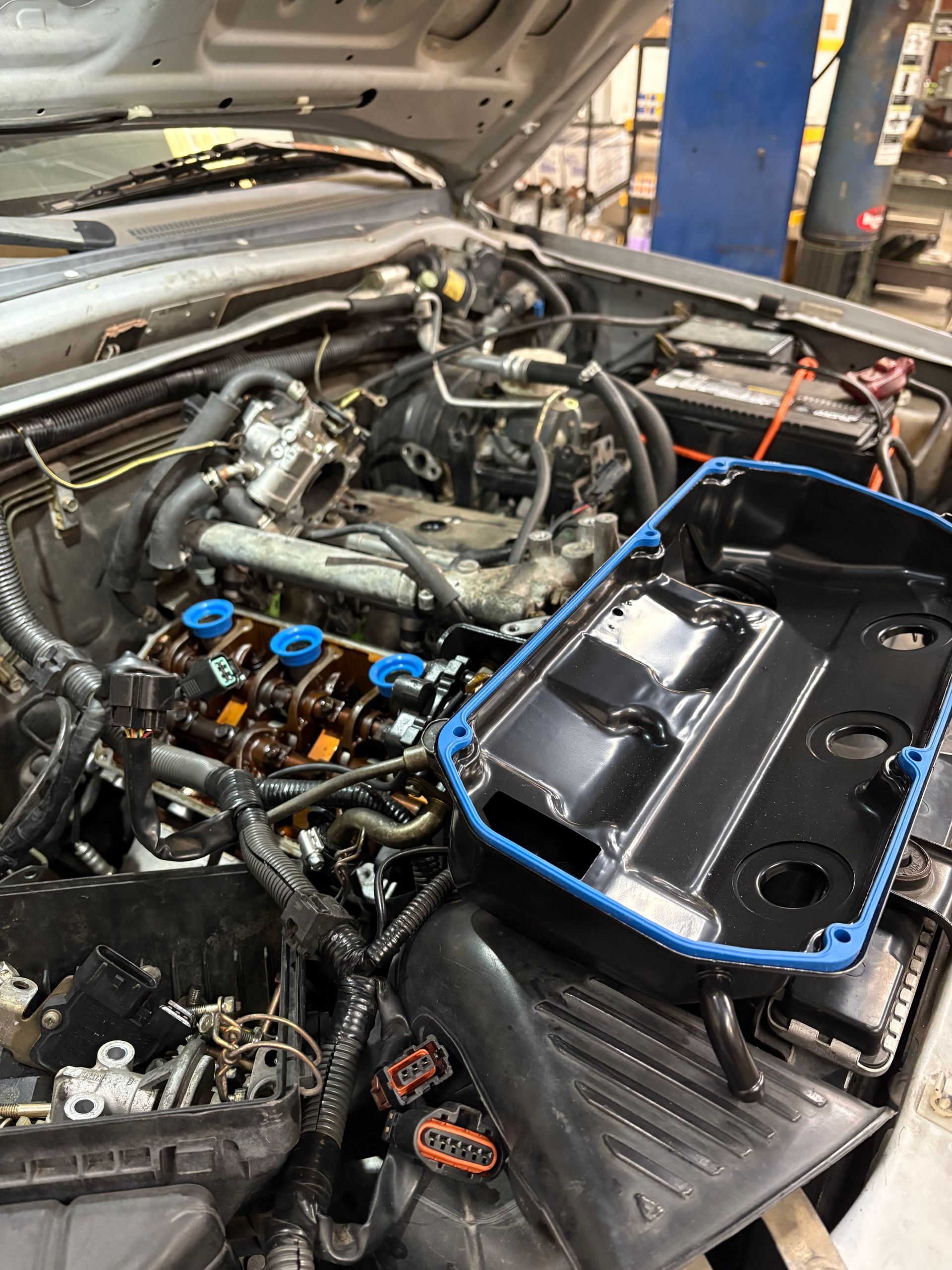 Replacing the valve cover gasket, plugs and wires on a Mitsubishi