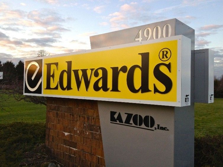 A sign on a brick wall