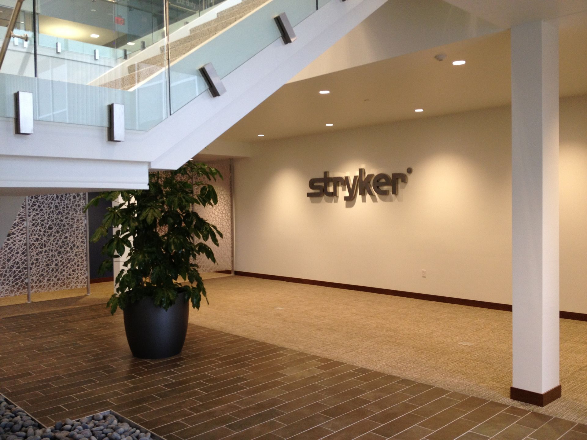 A staircase with a sign that says stryker on it
