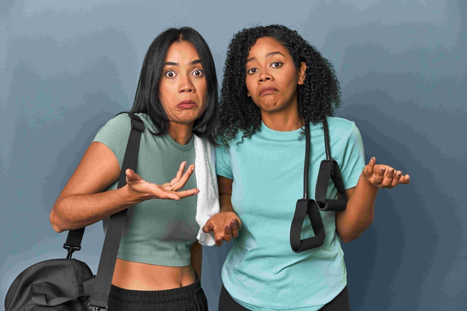 Two women are standing next to each other and making funny faces.