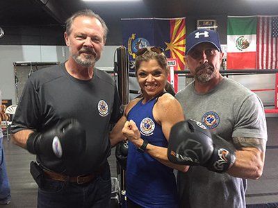 Training — Three Boxing Coaches Flexing for a Photo in Scottsdale, AZ