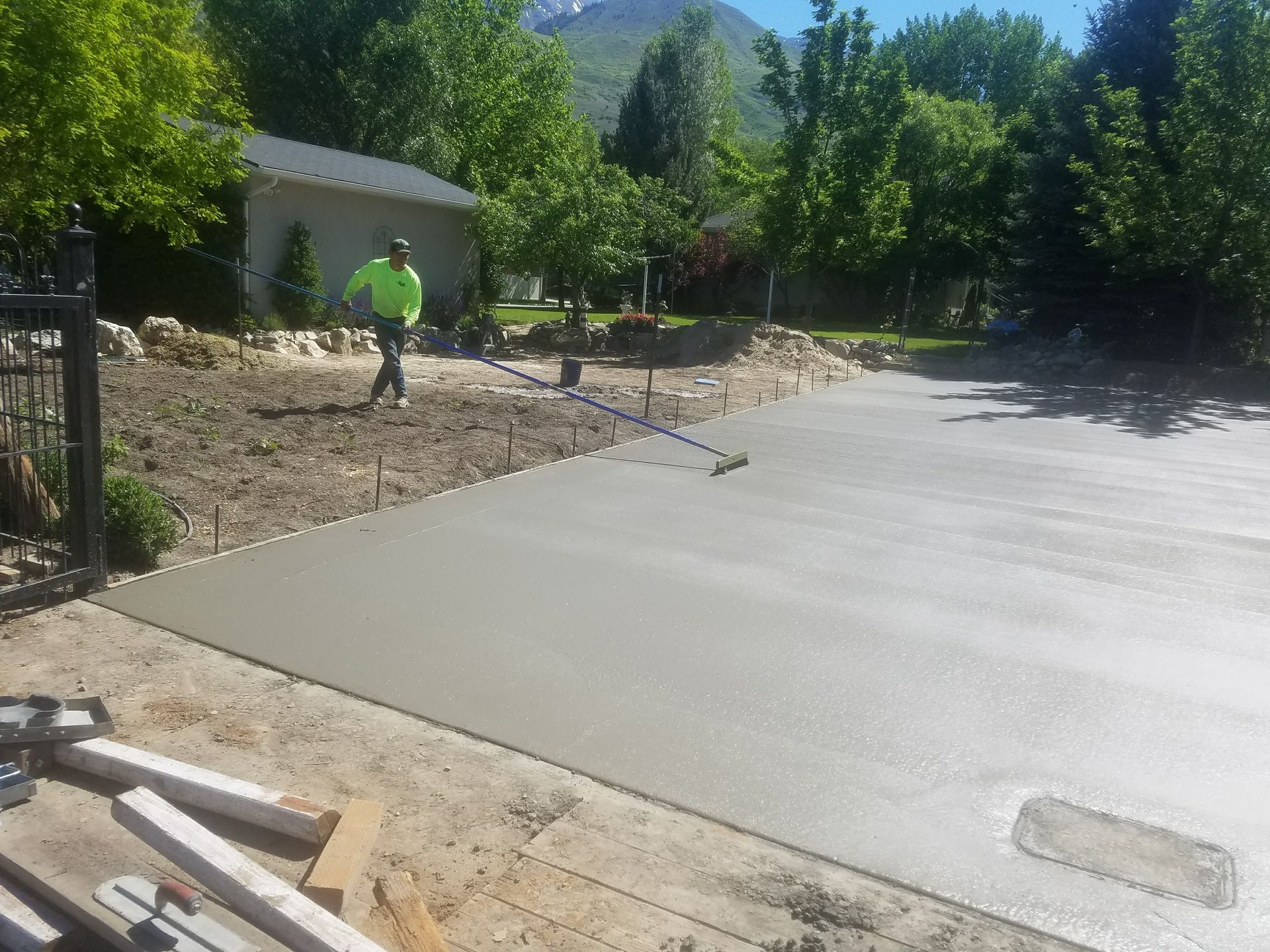 A row of houses with a white picket fence in a residential neighborhood.