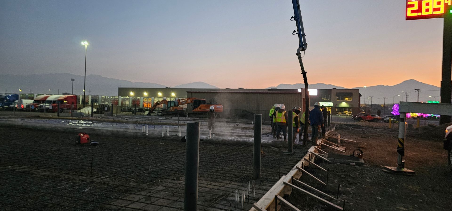 A row of houses with a white picket fence in a residential neighborhood.