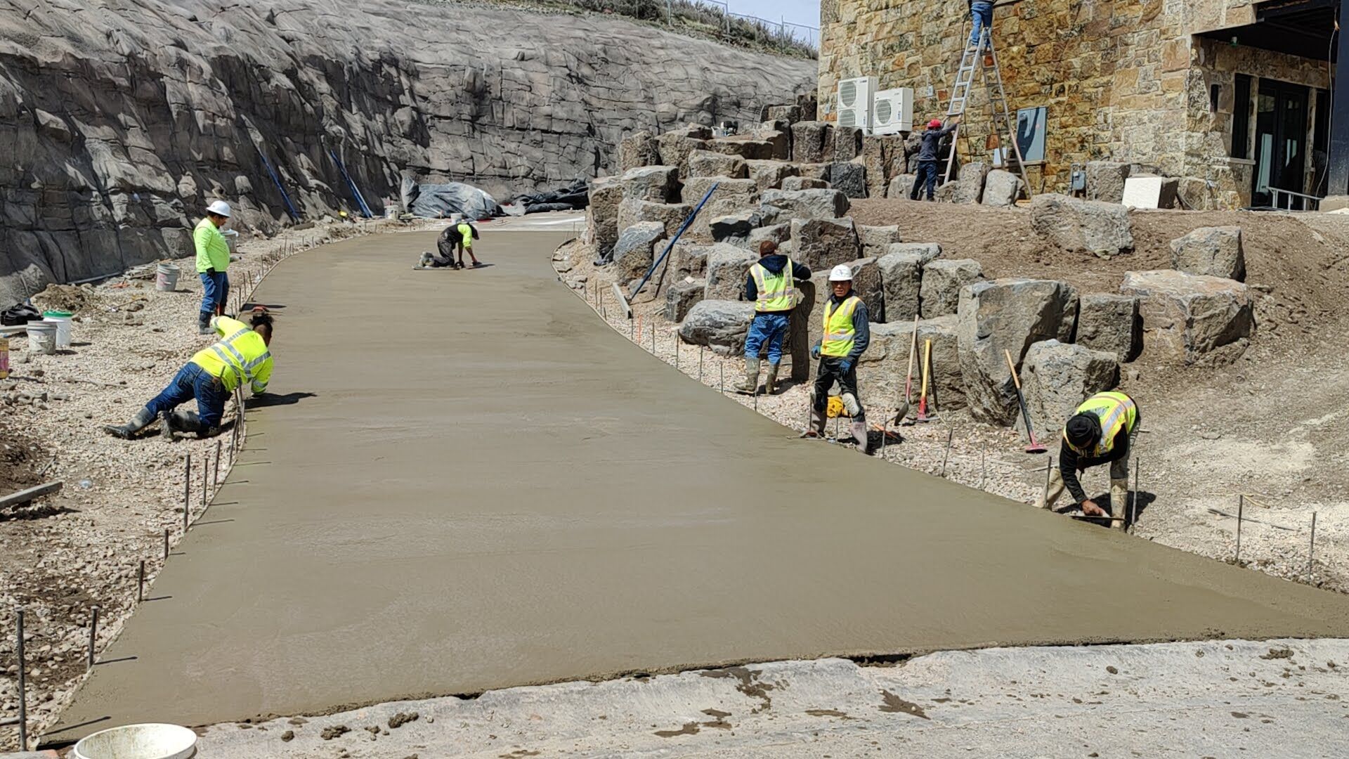A concrete foundation is being built in a residential area.