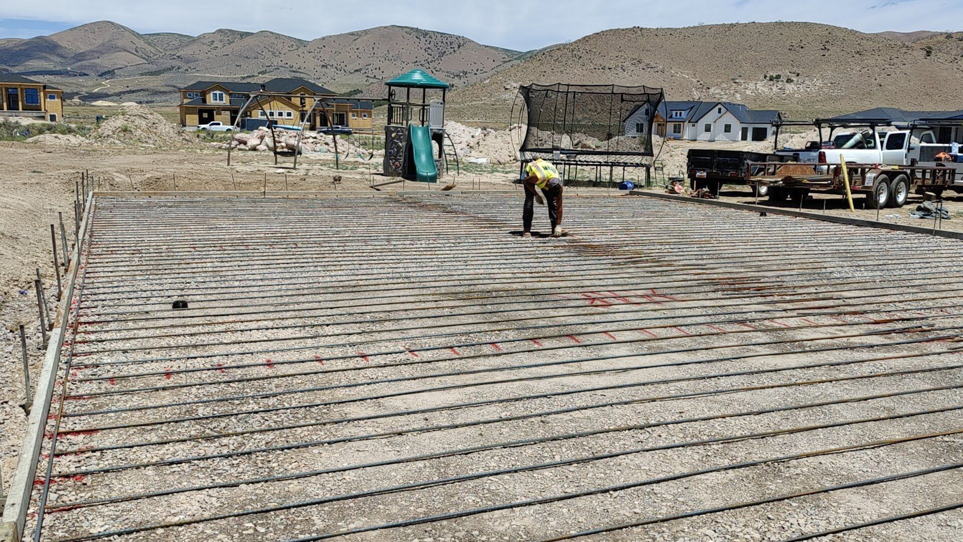 A room with a concrete floor and a window.