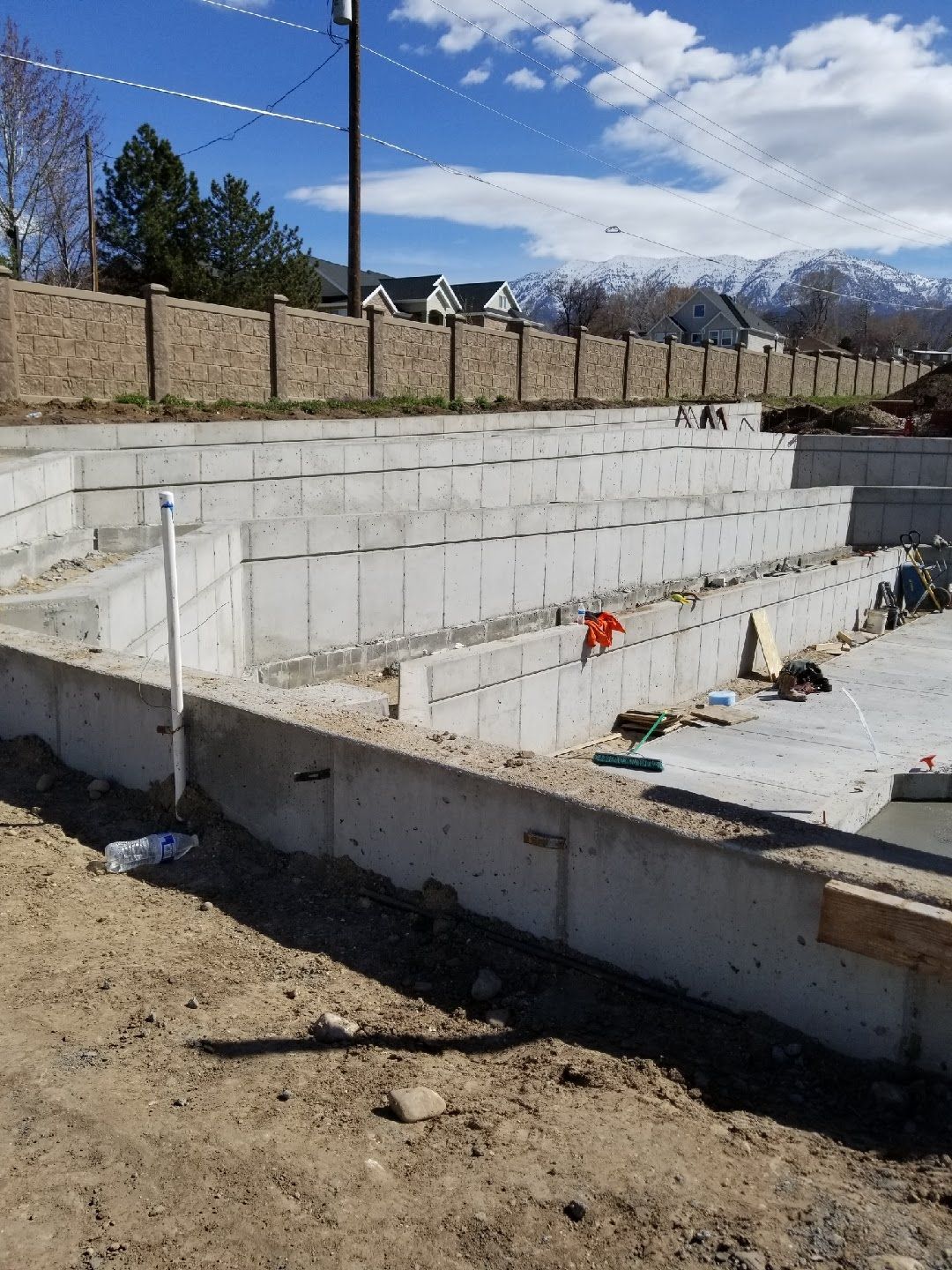 A concrete foundation is being built in a residential area.